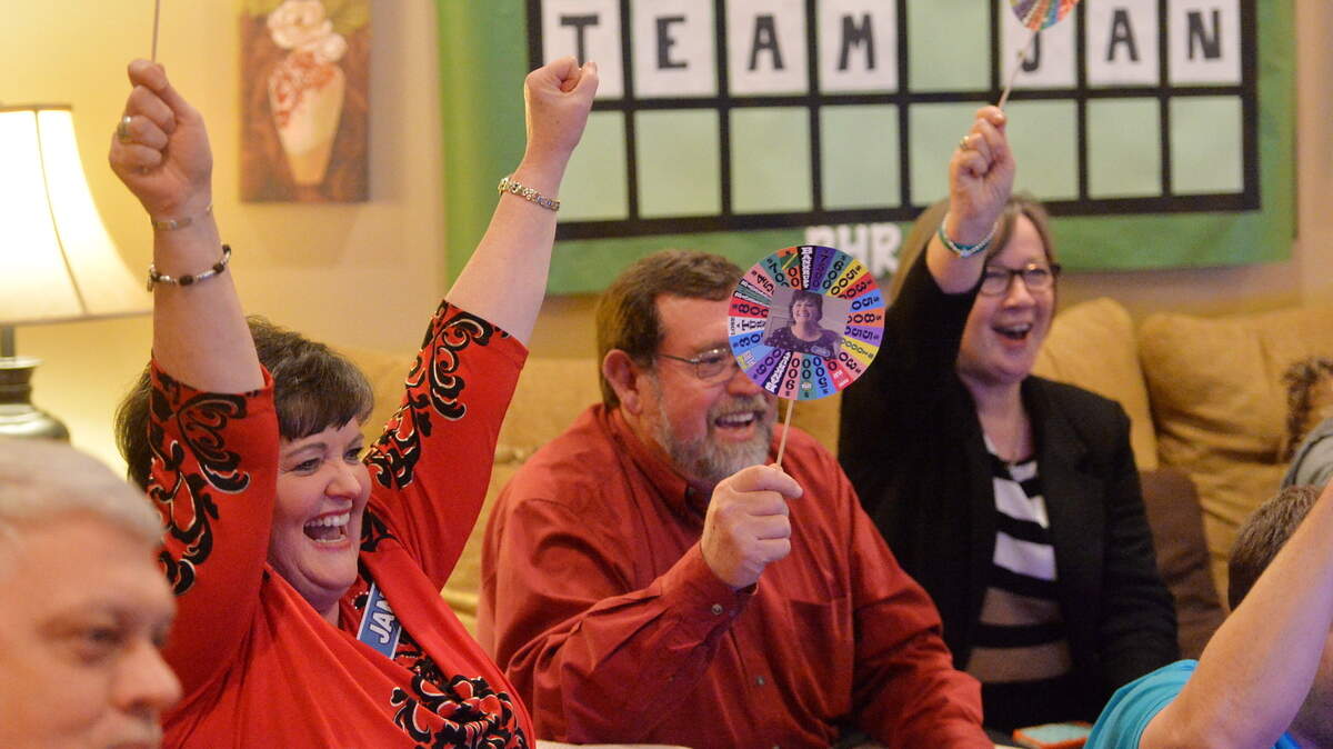 Jan Morton, second from left, celebrates winning on "Wheel of Fortune" at a Feb. 10 viewing party for the show that was recorded in January.