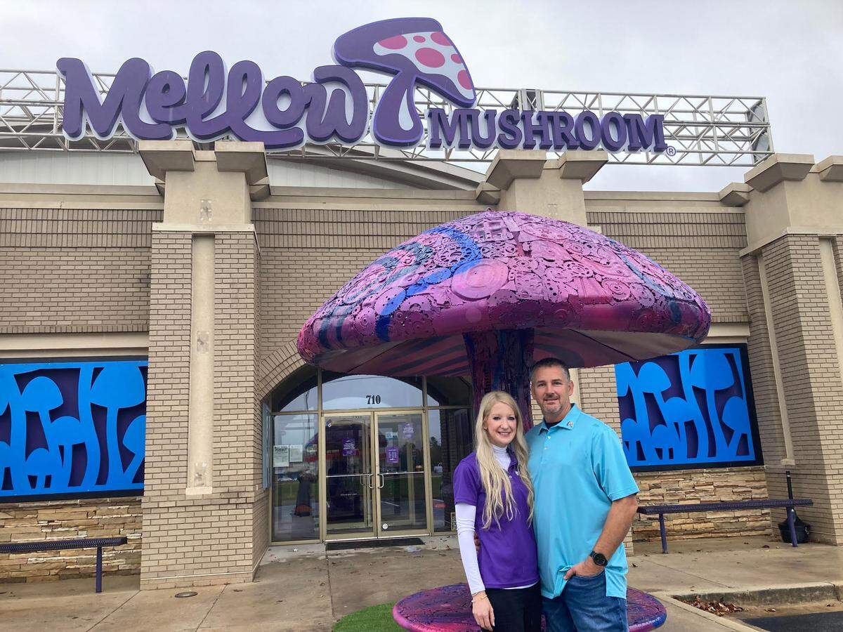 Brian and Brittanie Anderson, franchise owners of the Mellow Mushroom in Warner Robins, outside the newly remodeled restaurant.