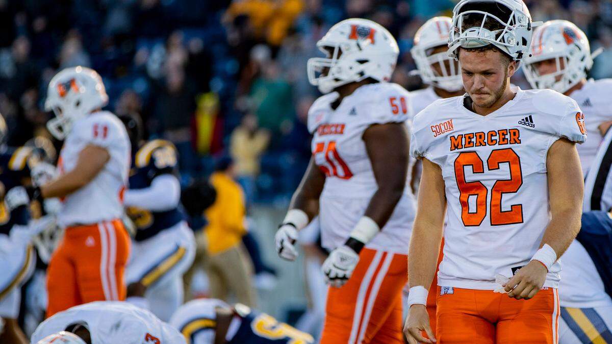 The Mercer Bears walk off the field after sophomore kicker Devin Folser’s unsuccessful field goal attempt to tie Eastern Tennessee State Saturday afternoon at William B. Greene Jr. Stadium in Johnson City, Tenn. Folser’s attempt was unsuccessful. ETSU defeated Mercer 38-35.