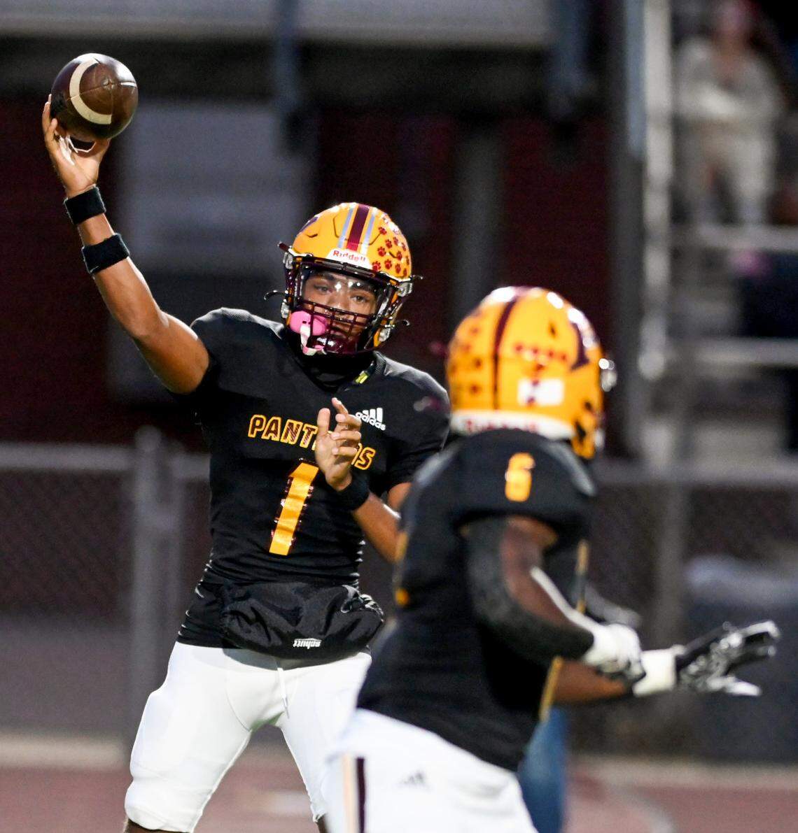 Perry quarterback Armar Gordon, Jr. (1) Rosses a short pass to running back Demetrious Carter (6) during the Panthers’ 39-7 win over Westside Thursday night.