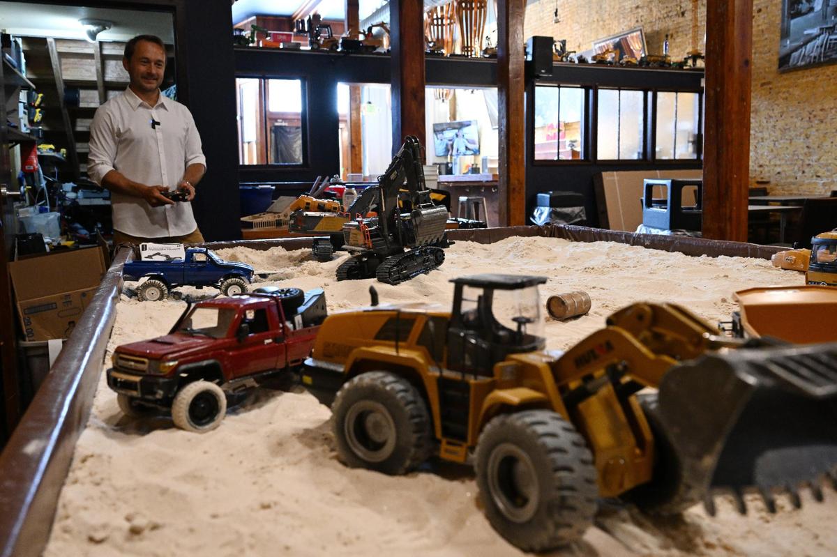 Late Night Macon and Tic Toc owner Wes Nobles races RC cars in Tic Toc’s new dig pit on Tuesday, June 10, 2025, in downtown Macon, Georgia. Nobles plans to open the new space, which will include a bar and late night food options and is next door to his downtown night club Late Nite, in mid-July.