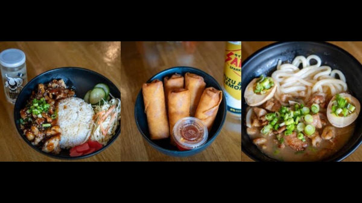 From left to right: chicken donburi, vegetable harumaki and karamiso udon sit on a table in the Macon location of Tenmii Japanese Eatery. 