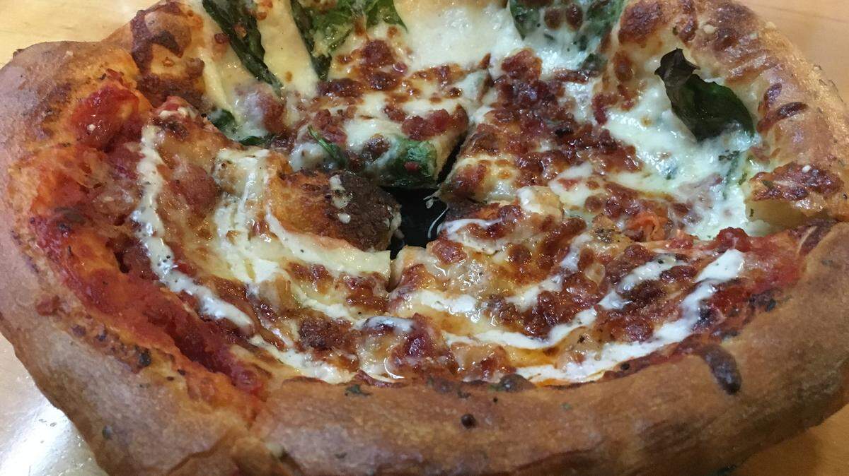 The Mother Clucker at Fatty’s Pizza is topped with chicken, bacon and a drizzle of ranch dressing.