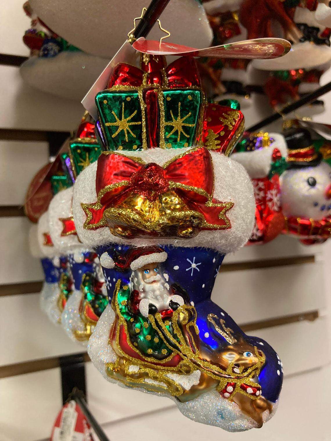 Christmas ornaments by Christopher Radka hanging in a popular downtown Perry shop that will soon rebrand as Sweet Evelyn’s.