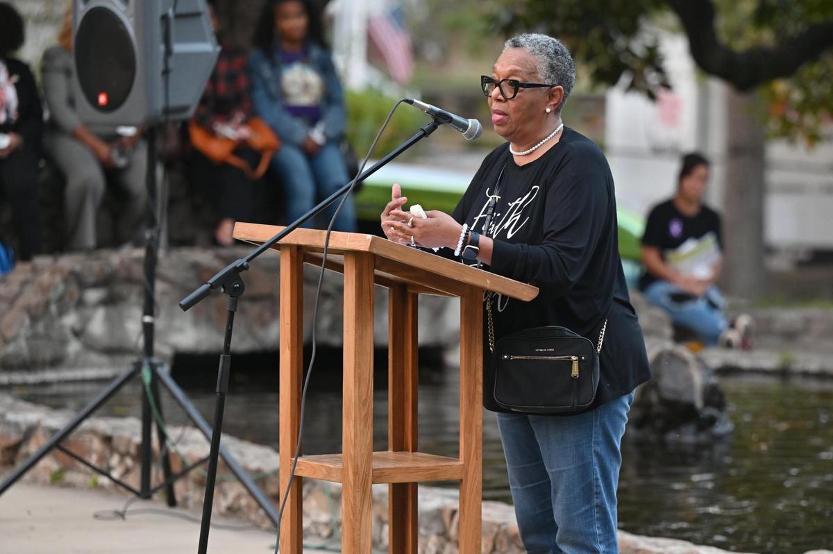 Domestic violence survivor Vernice Carson speaks about her experience at the Domestic Violence Awareness candlelight vigil on Tuesday, Oct. 29, 2024, in Washington Square Park in Macon, Georgia. The vigil presented by Rescue Mission of Middle Georgia and Crisis Line and Safe House of Central Georgia honored victims of domestic abuse at the end of October, which is National Domestic Violence Awareness Month.