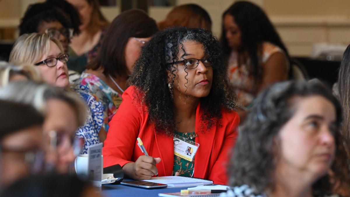 CC Educational Training Services director of professional learning Consuella L. Carter takes notes from the keynote speaker during the Governor’s Summit on Early Language and Literacy on Tuesday, July 8, 2025, inside of the Magnolia Ballroom at Georgia College and State University in Milledgeville, Georgia. The opening address given by Dr. Paige C. Pullen focused on the science of literacy.