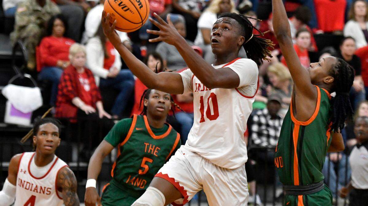 Dodge County’s Keegan Williams (10) puts up a shot off the glass during the Indians’ 60-41 win over Rutland in the first round of the GHSA playoffs Wednesday.