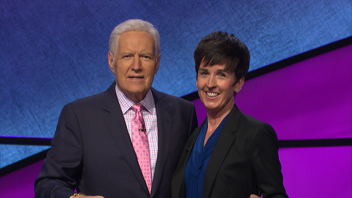 Jeopardy! contestant Laura Thomason, who is an English professor at Middle Georgia State University, with show host Alex Trebex.