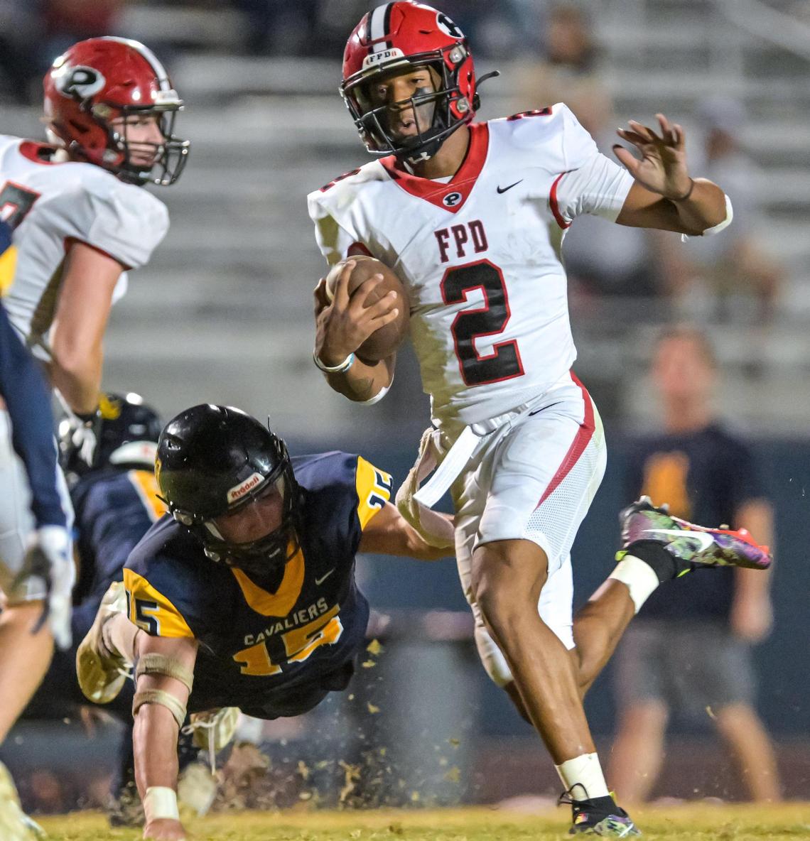 FPD quarterback Jakhari Williams slips a tackle and heads for the endzone in their 36-10 win over Mount de Sales.