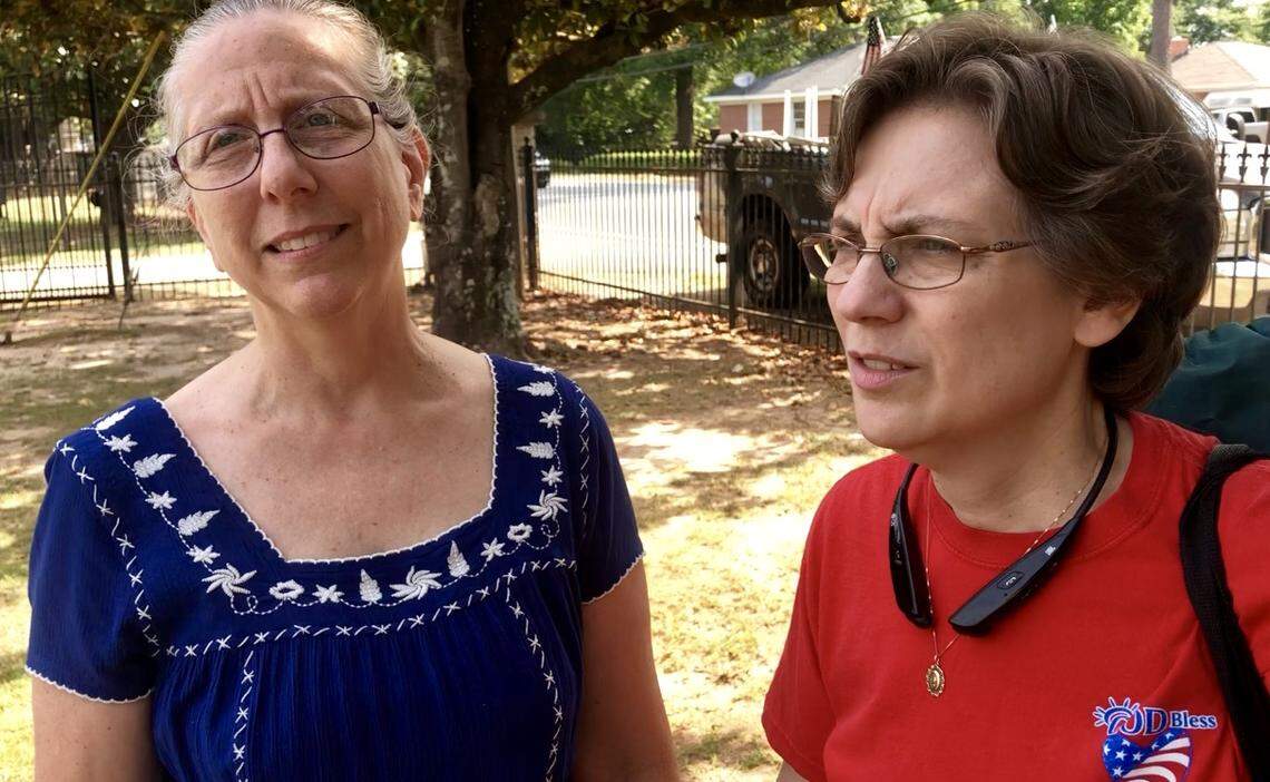 Tina Sauls, left, and Teresa Baumann, sisters of Army Cpl. Eric J. Baumann who was killed in a 1985 plane crash in Canada that claimed the lives of 248 U.S. service members.