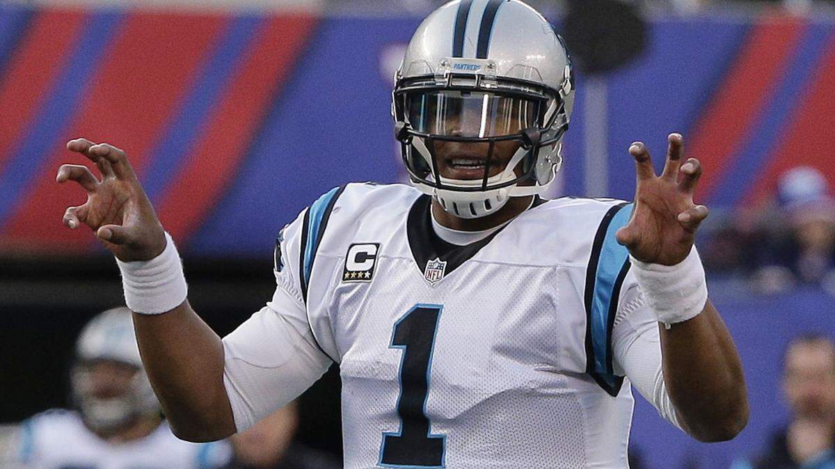 FILE - In this Dec. 20, 2015, file photo, Carolina Panthers quarterback Cam Newton calls an audible at the line of scrimmage during the second half of an NFL football game against the New York Giants, in East Rutherford, N.J. Arizona and Carolina play in the NFC Championship game on Sunday, Jan. 24, in Charlotte, N.C.