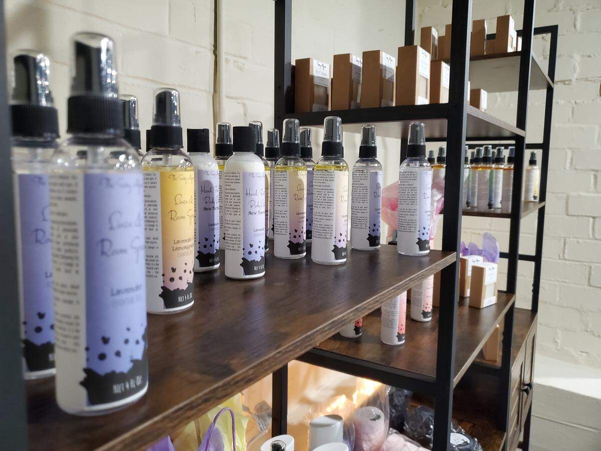 Linen and room spray on the shelves at The Sassy Alpaca to open soon in Ingleside Village in Macon.