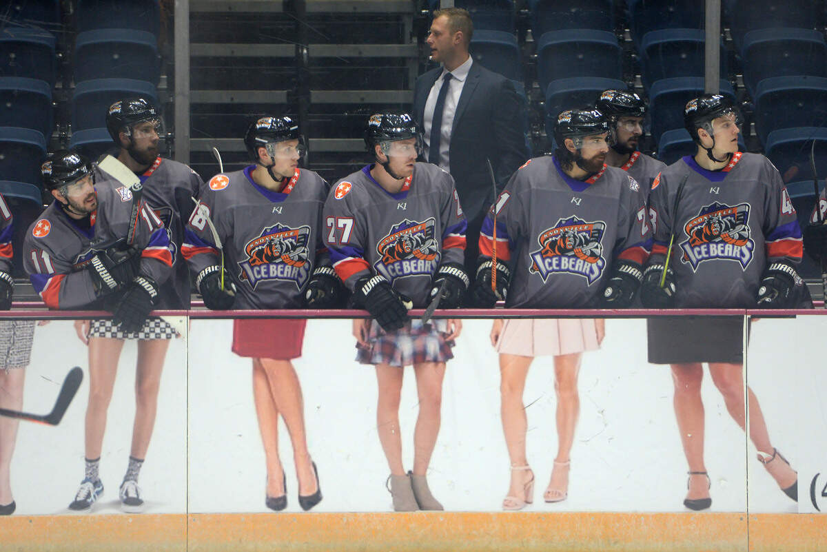 The Knoxville Ice Bears stand in front of the dasher board in their game against the Macon Mayhem at the Macon Coliseum on Friday, Oct. 26. The dasher board is an advertisement sponsored by Ann Parman Law.