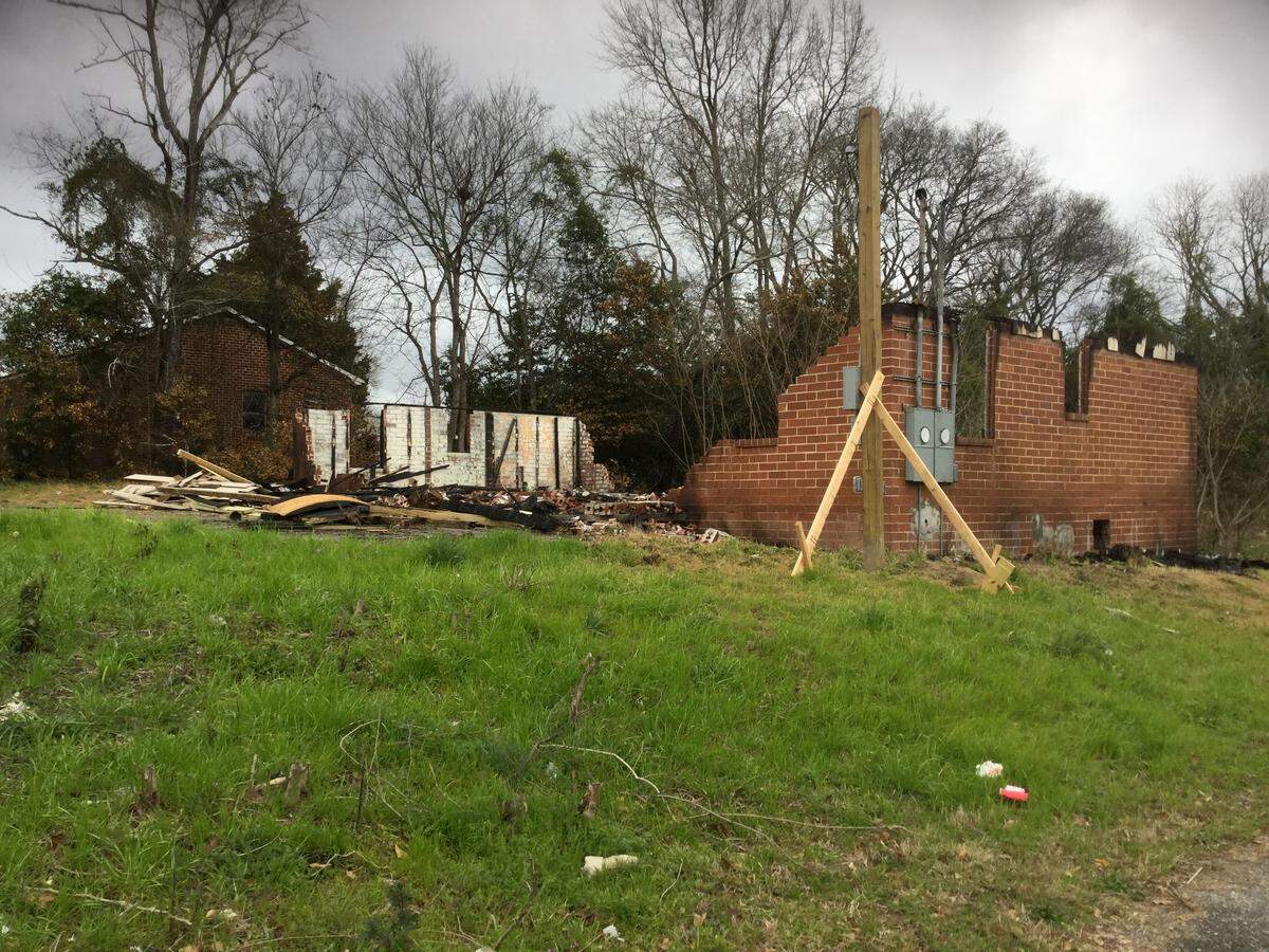 Macon-Bibb County fire investigator Lt. Ben Gleaton said someone set fire to this Fort Hill house on Short Street at Clark’s Lane before 4:30 a.m. Tuesday.