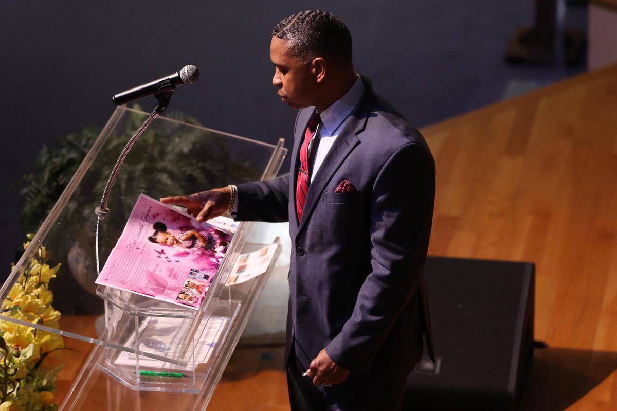 Macedonia Baptist Church senior pastor Belvin Ware looks through the program before the start of the funeral of A’Layah Danielle Joyner on Saturday, April 26, 2025, at Macedonia Baptist Church in Macon, Georgia. “Let us speak up, let our voices be heard and let’s make sure that the life of A’Layah lives on,” Ware said in brief remarks during the funeral.