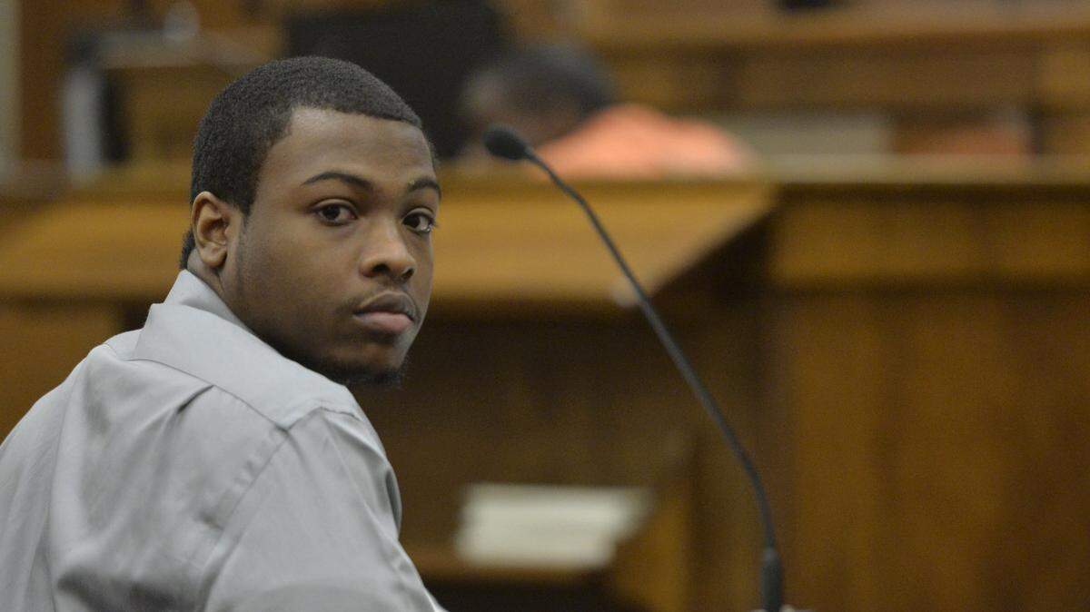 Jedarrius Meadows, left, looks back to an exiting gallery during a break in his murder trial Wednesday.