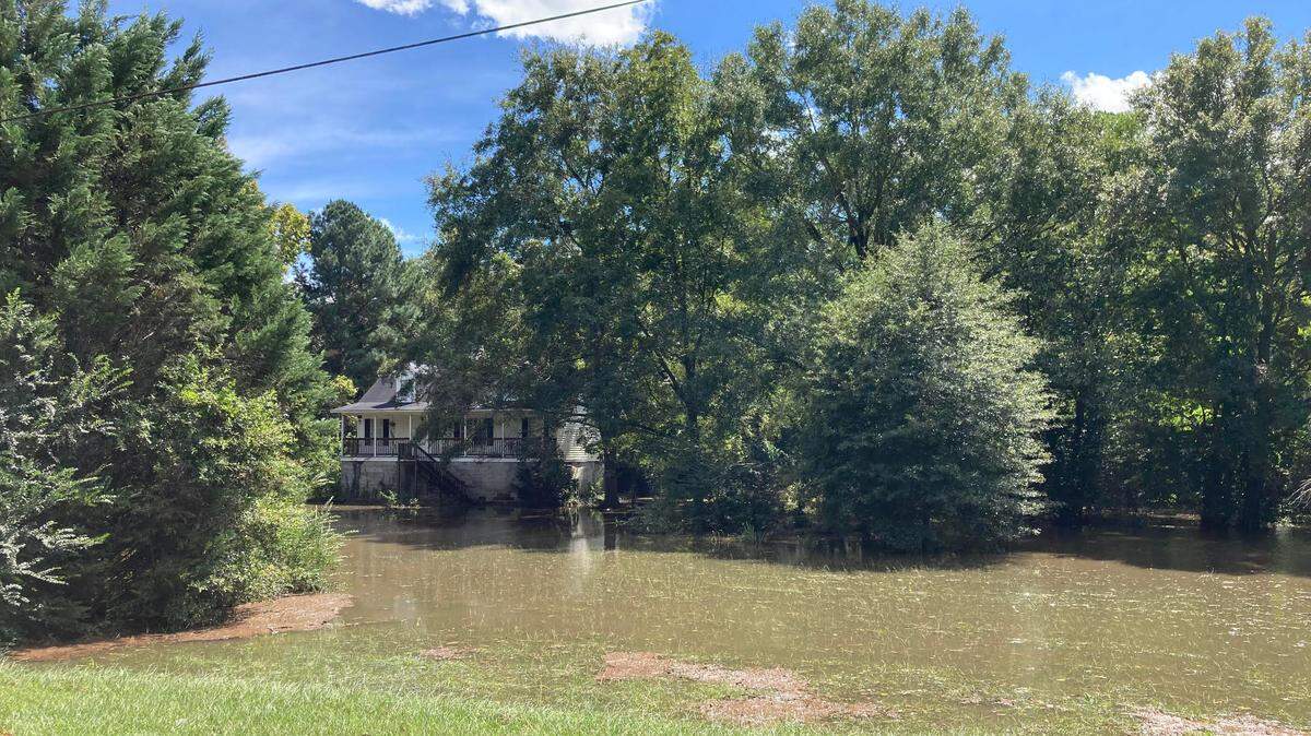 Flooding around a house in the background off Brantley Road in a low-lying area of Centerville on Friday. Houston County escaped the brunt of Hurricane Helene but did experience wind gusts up to 50 miles per hour, downed trees, power outages, flash flooding, and road closures during the height of the storm.