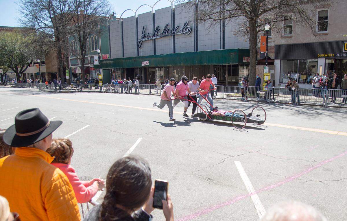 The Float Daze bed races down Cherry Street Saturday during the Cherry Blossom Festival Bed Race.