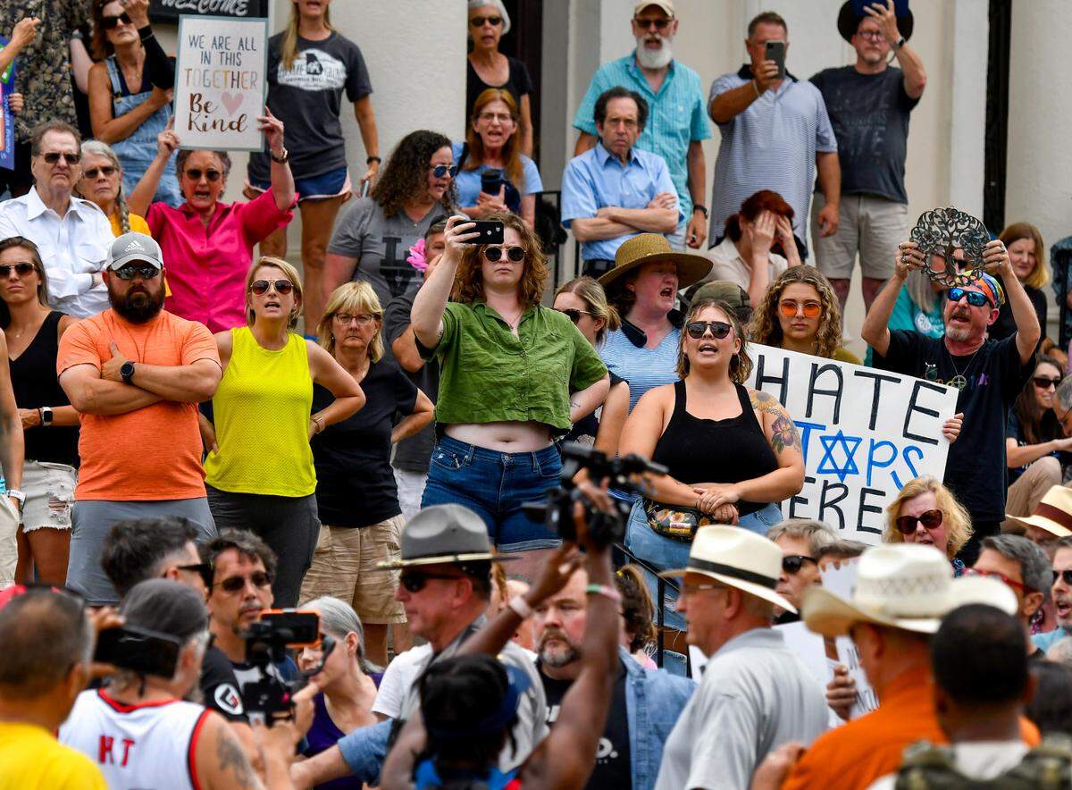 Hundreds of people chant after an antisemitic hate group showed up a for a counter-protest at Temple Beth Israel Saturday afternoon. The counter-protest was scheduled after the antisemitic hate group gathered outside the Temple Friday.