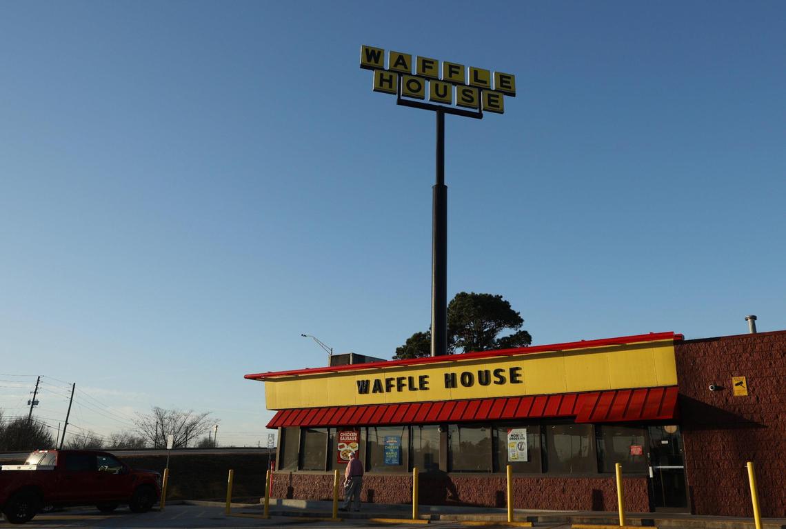 A patron walks outside of the northbound Waffle House in the morning of Sunday, Feb. 2, 2025, in Byron, Georgia. Although they’re not the two closest Waffle Houses in Georgia, the Exit 49 Byron Waffle Houses sit just 0.3 miles apart on the same road.