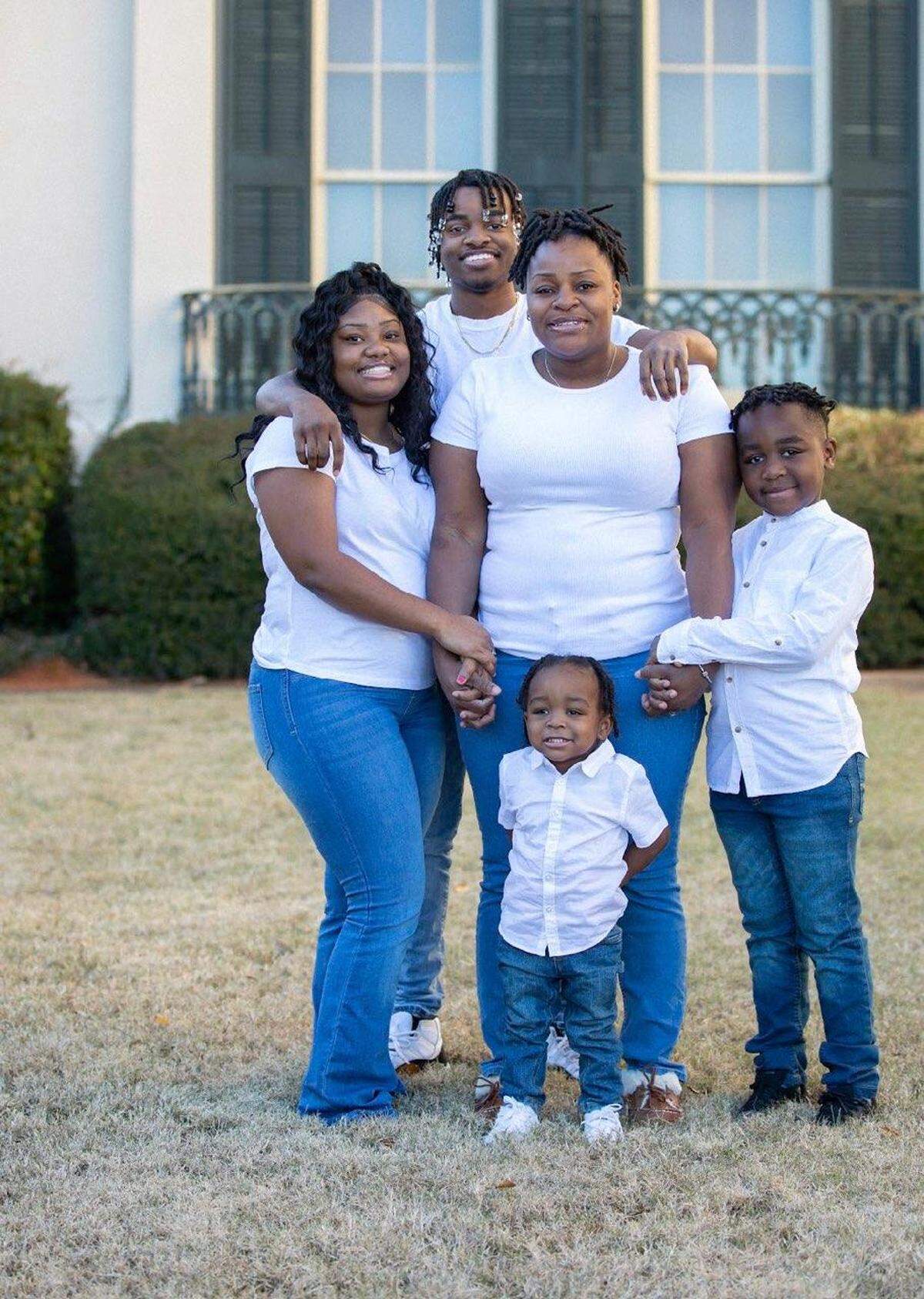 Vequita Gore, center, with her children, Robert Berrian, 18, Rodrico Gore, 8, DeShawn Gore, 2, and Ta-Shayla Johnson, 19. Vequita and her husband, Rodrico Gore (not pictured) own and operate Party Ice at 3271 Houston Ave. in south Macon.