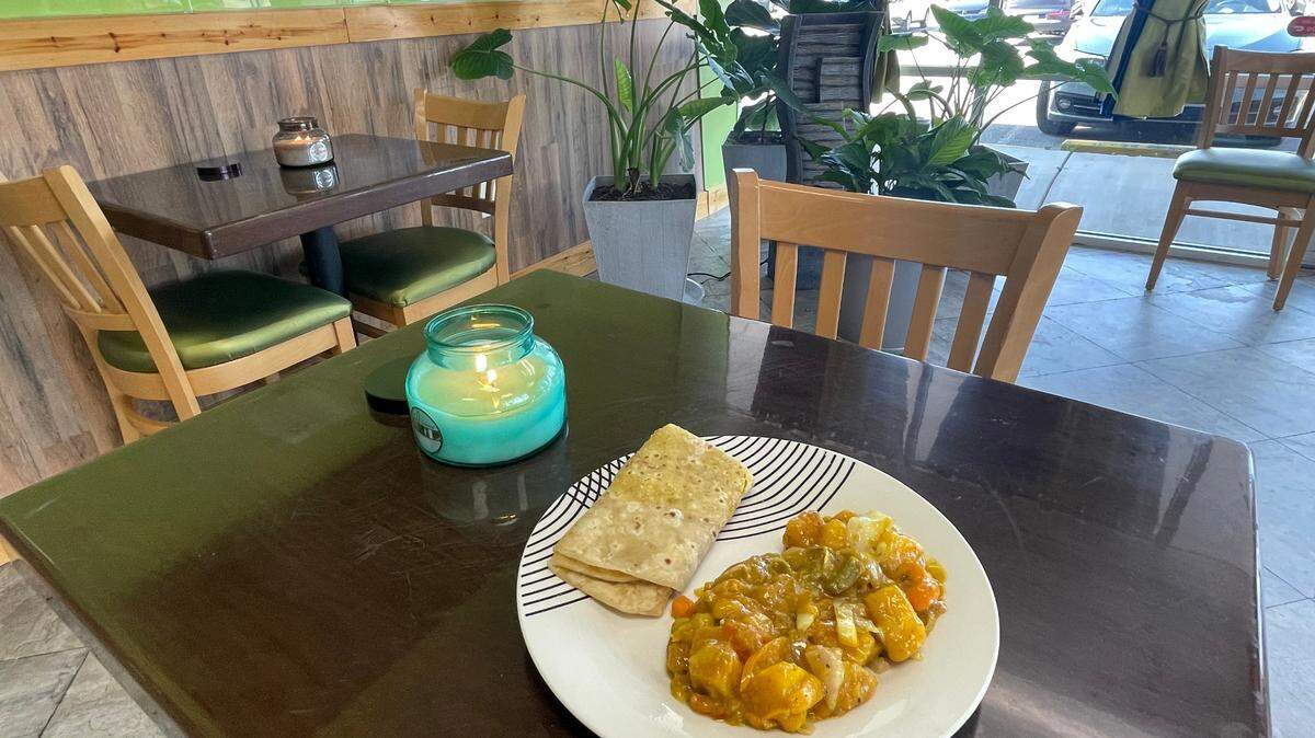 Roti skin (a flat bread) with curry vegetables of potatoes, corn, carrots, bell peppers and green beans at Crooklyn Roots in Byron.