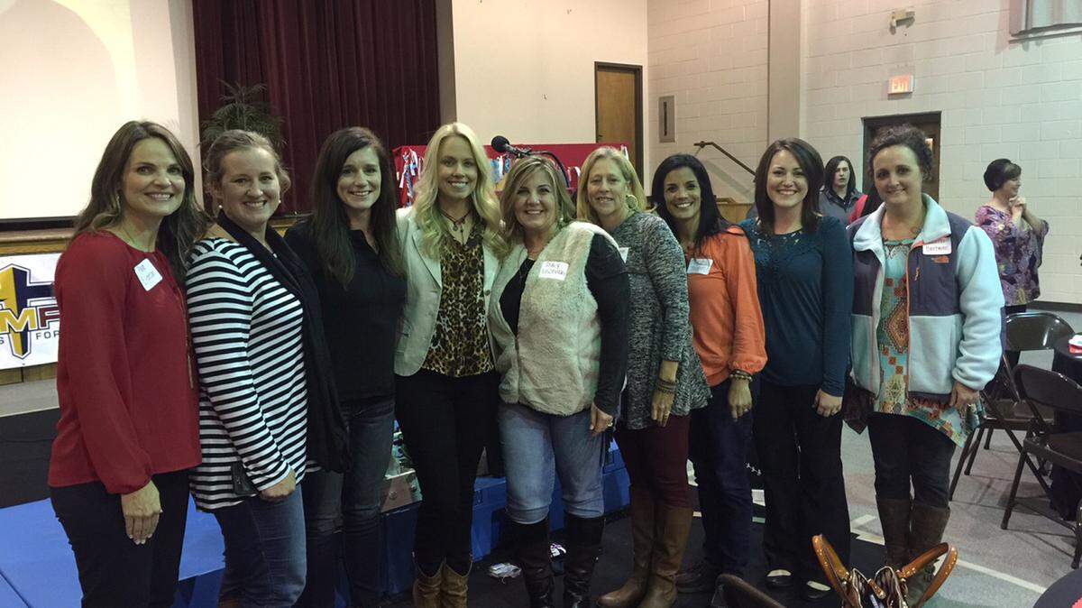 Shannen Fields, fourth from the left, star of "Facing the Giants," is shown pictured with a group of coaches' wives at the Flint River FCA's Coach's Wives and Female Coaches Appreciation Dinner.