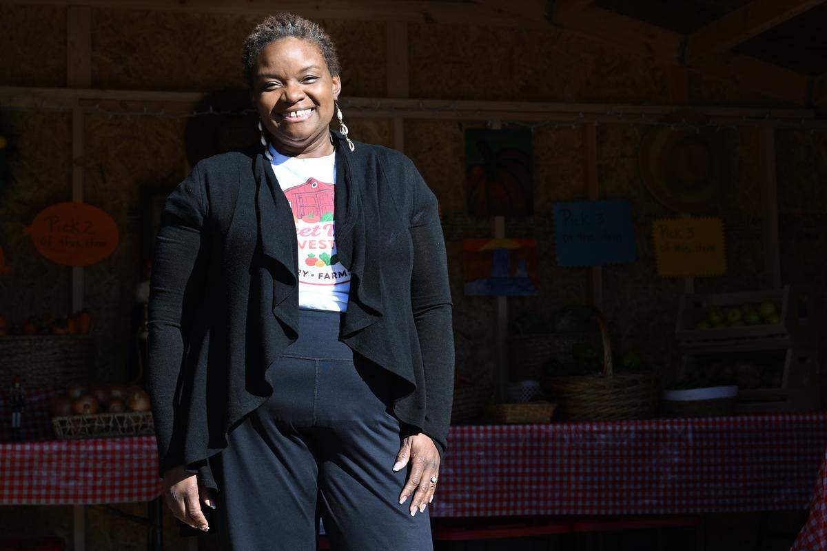 Hamidah Sharif poses for a portrait outside of the Sweet Valley Harvest Barn on Thursday, Dec. 11, 2025, in Fort Valley, Georgia ahead of its official opening. Dr. Sharif runs Sweet Valley Farm which houses Sweet Valley Harvest Barn, a micro grocery store that offers fresh and local produce for cheap. 