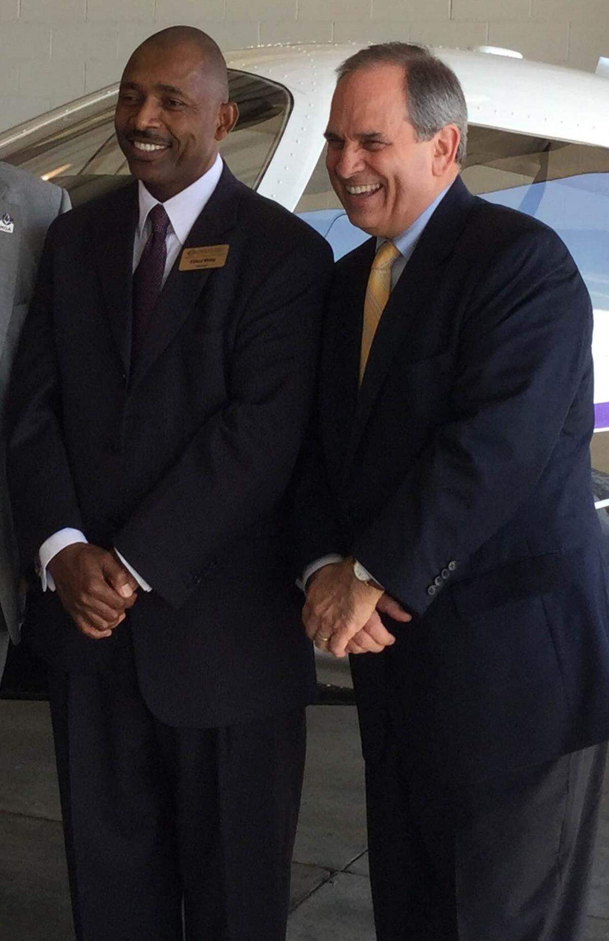 Then-Macon-Bibb County Industrial Authority Chairman Cliffard Whitby, left, is pictured with Macon-Bibb County Mayor Robert Reichert at the Macon Downtown Airport in October 2015.