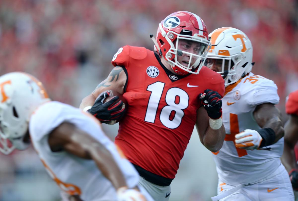 Georgia tight end Isaac Nauta (18) splits the Tennessee defense as he heads for the end zone after picking up a fumble by Jake Fromm on the Tennessee 31-yard line Saturday. It was the first score of the game. Georgia beat Tennessee 38-12.