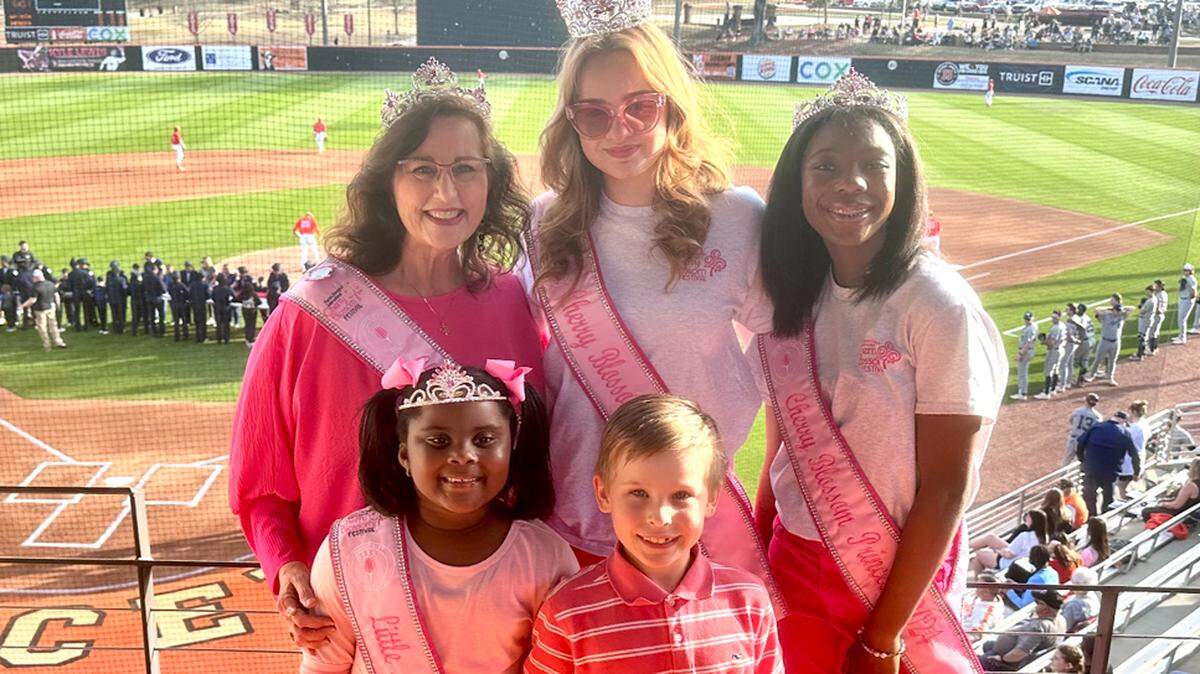 Members of the 2024 Cherry Blossom Royal Court were recognized at the Mercer University Bears baseball game Tuesday, just one of the ways the group serves and is recognized by the city as Macon ambassadors. The court includes Cherry Blossom Queen Remie Heide, Cherry Blossom Princess Karmen Hill, Cherry Blossom Legacy Queen Liz Fabian, Little Miss Cherry Blossom Alexandria Habersham and Little Mr. Cherry Blossom Beau Mote sporting a pink cast for “The Pinkest Party on Earth.”
