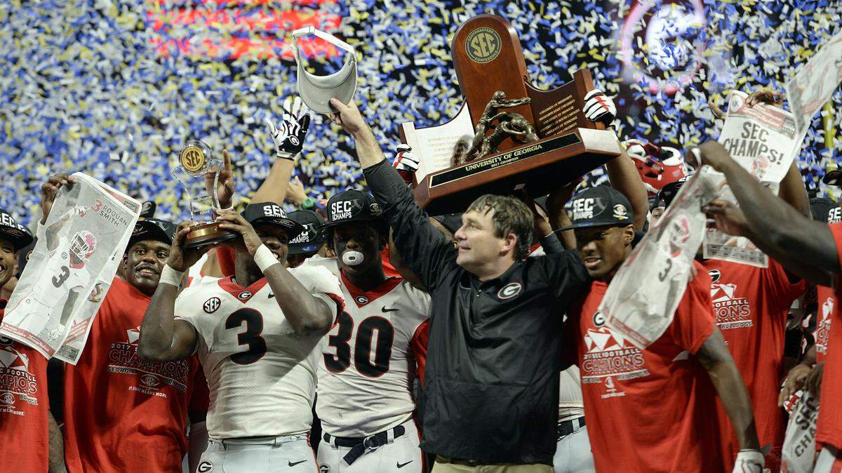 The Georgia Bulldogs celebrate their SEC Championship win over Auburn, 28-7.