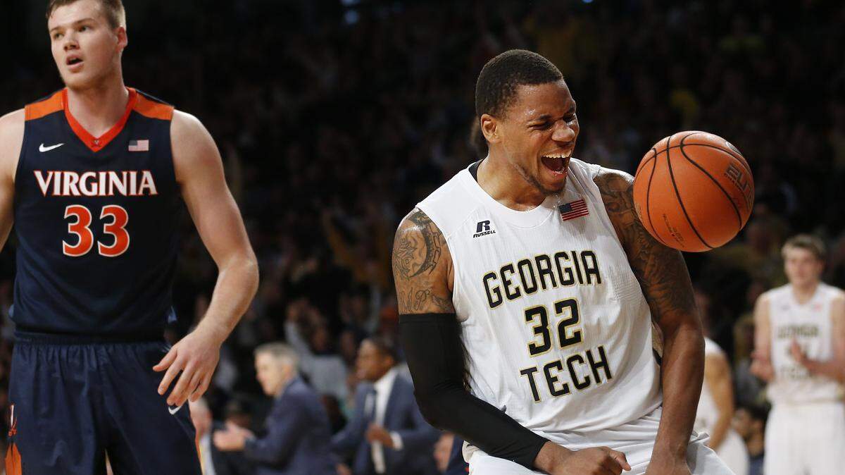 Georgia Tech's Nick Jacobs, right, celebrates a 3-point basket by teammate Quinton Stephens, not pictured, as Virginia's Jack Salt, left, turns to run down the court in the second half of Saturday's game in Atlanta.