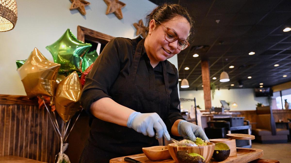 Restaurant partner Alma Valencia mixes ingredients together for fresh made chunky guacamole at Cozumel Mexican Grill on Wednesday, April 23, 2025, in Perry. The restaurant’s chunky guacamole is made fresh at the table for customers.