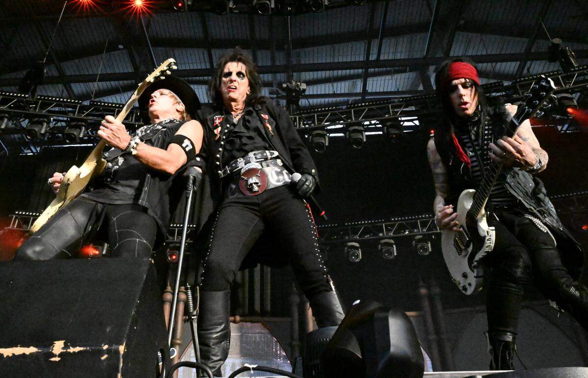 Alice Cooper (middle) performs with guitarist Ryan Roxie (left) and guitarist Tommy Henriksen during An Evening with Alice Cooper on Saturday, May 3, 2025, at Atrium Health Amphitheater in Macon, Georgia.