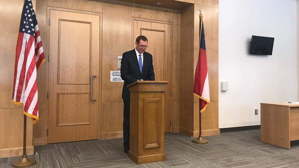 Bibb County District Attorney David Cooke discusses the Macon-Bibb County School-Justice Partnership Agreement at its signing on Tuesday.