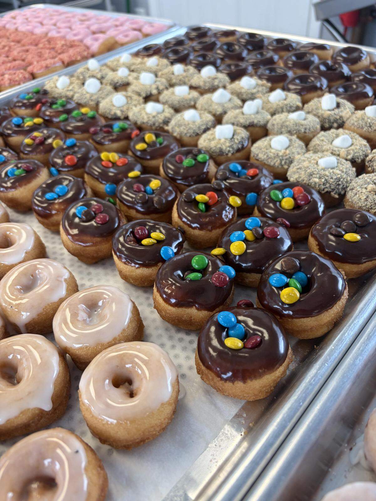 A batch of freshly made Little Light Coffee Co. vanilla cake mini doughnuts ready to be packed up and delivered to the main coffee shop off Watson Boulevard and the new drive-thru off Ga. 247.