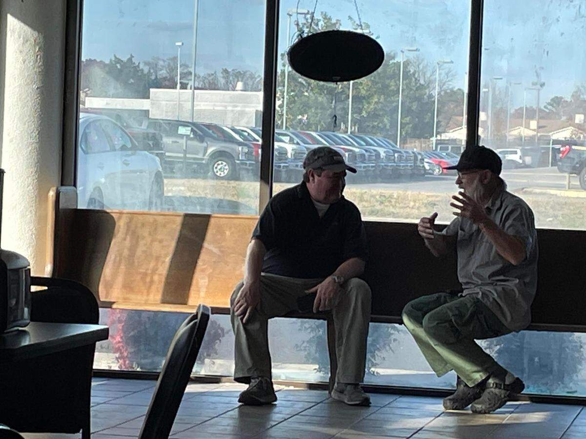 Andy Clark of the new Baldinos Giant Jersey Subs in Warner Robins, left, talks with Mike Wellons of the former Mike’s Hot Dogs & Hamburgers, which was previously housed in the building that is now home to the new Baldinos.