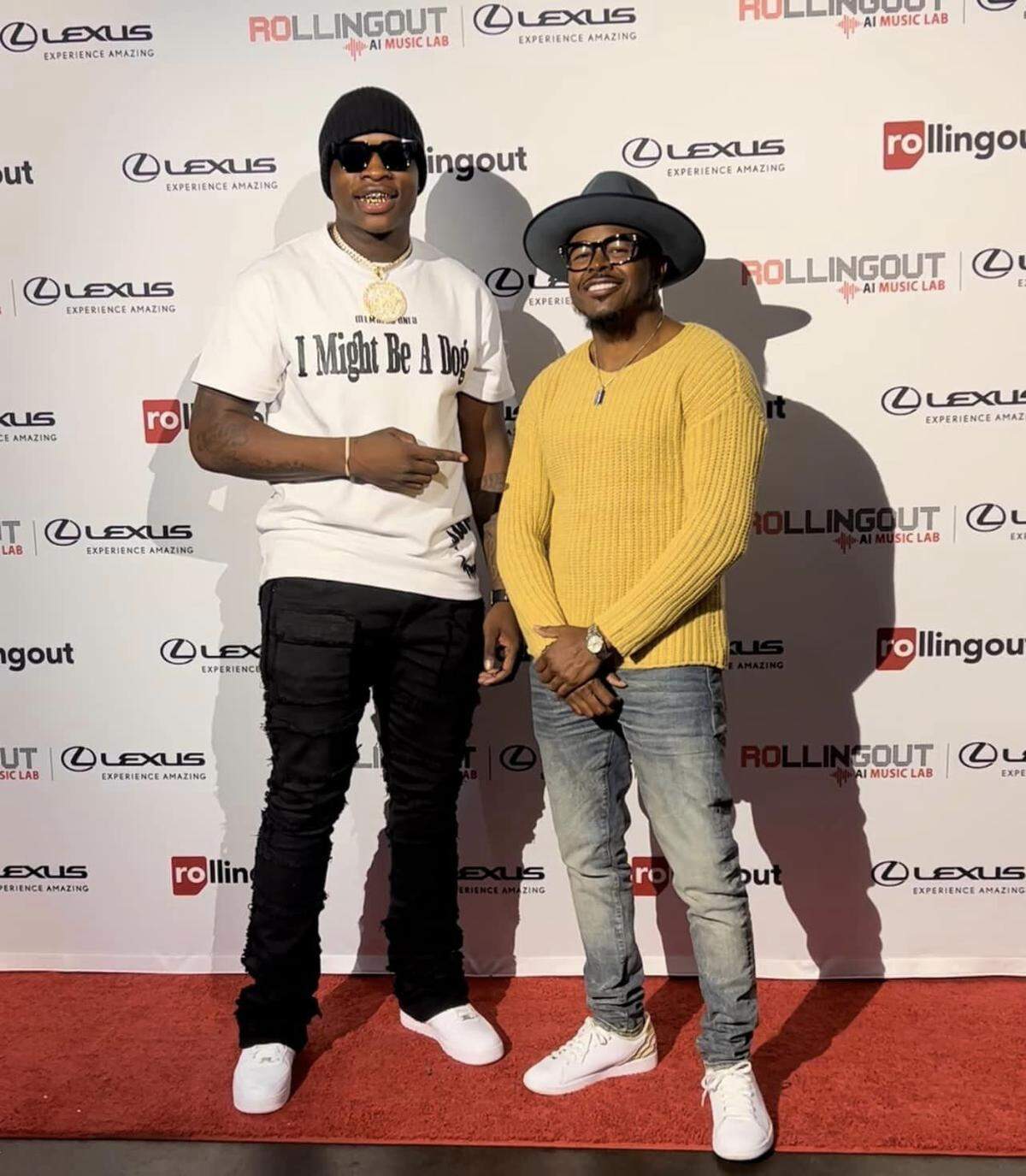 Mike Clark, Jr. (left) smiles for a photo with founder of Collipark Records Michael Crooms at a Lexus reveal event in Atlanta hosted by Rolling Out.