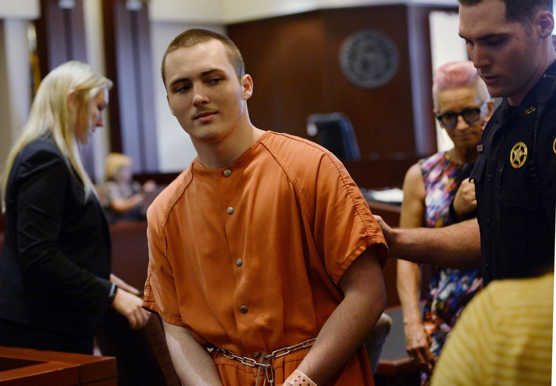 Dakota White is taken back to jail Tuesday after Houston County Superior Court Judge Edward D. Lukemire sentenced White to life in prison without the possibility of parole in the killing of Sam Poss.