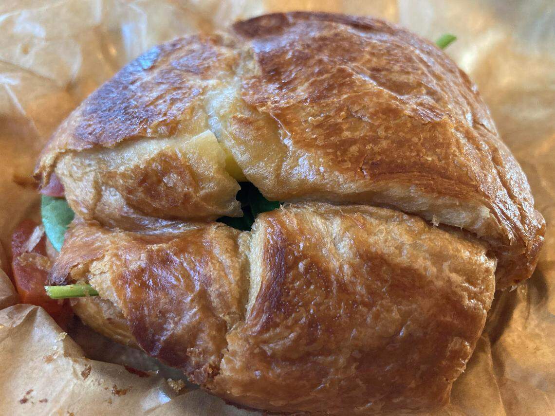 A sausage, egg and cheddar on a croissant with spinach and tomato at the new Z Beans Coffee at 102 South Armed Forces Blvd. in Warner Robins.
