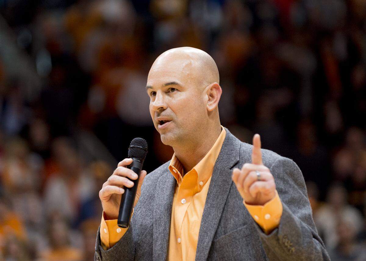 New Tennessee head football coach Jeremy Pruitt speaks to the audience before the first half of an NCAA college basketball game.