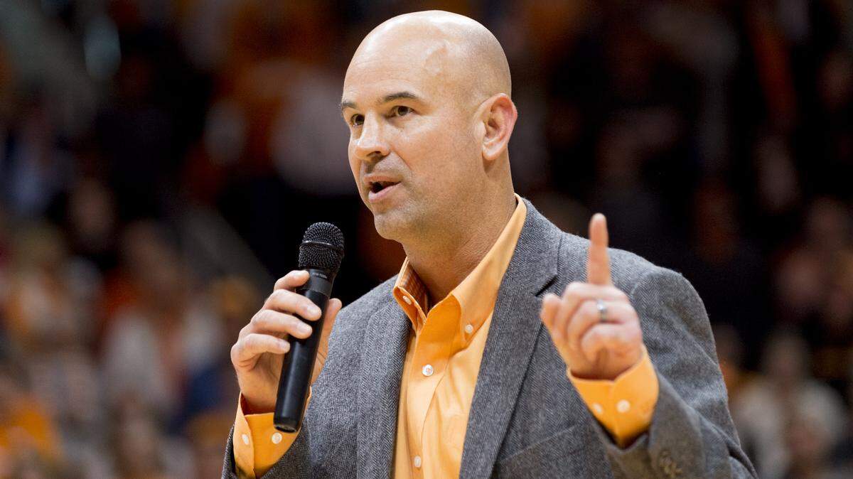 New Tennessee head football coach Jeremy Pruitt speaks to the audience before the first half of an NCAA college basketball game.