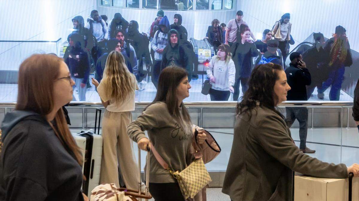 Passengers make their way through Hartfield-Jackson International Airport in Atlanta on Friday, Nov. 22, 2024. Nationally, AAA predicts a record 119.3 million people will leave home between Dec. 21 and New Year’s Day.