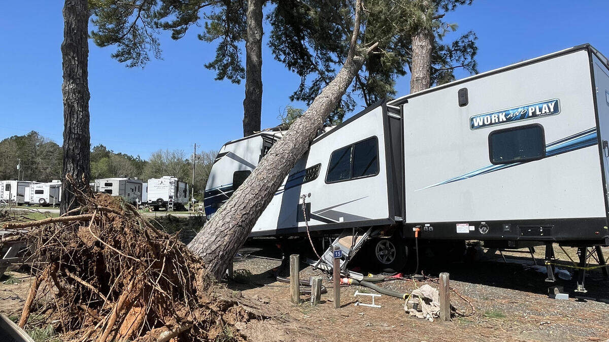 A severe storm topples a tree across an RV at the Ponderosa RV Park off Ga. 96 in Peach County on Thursday, March 12, 2026.