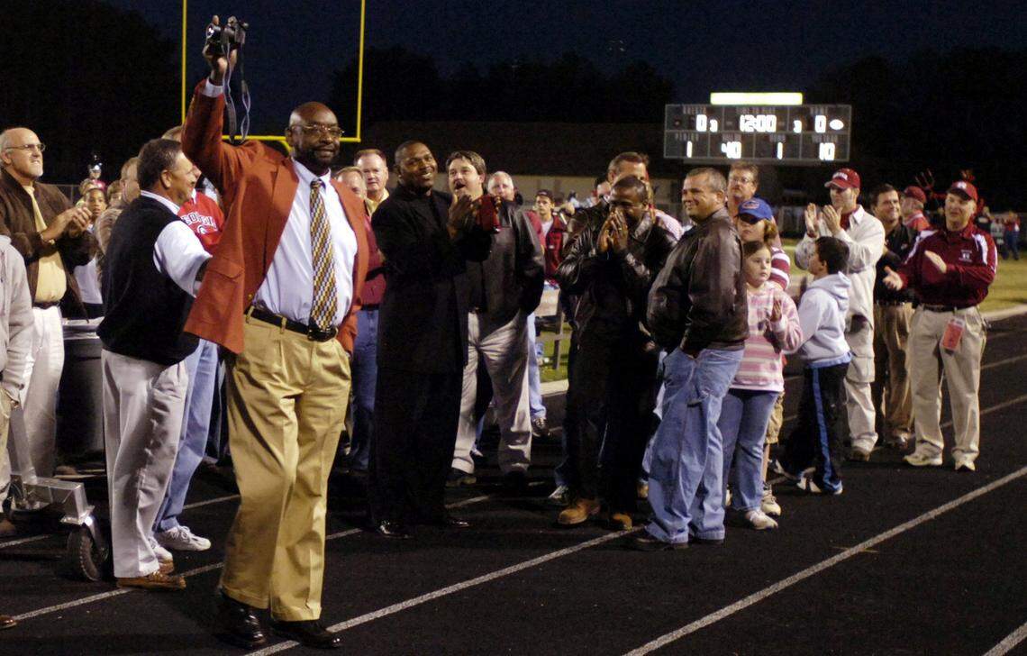 Members of the Warner Robins 1976, 1981 Sate and National Championship teams are recognized prior to the Demons game against Coffee in this 2006 Telegraph file photo.