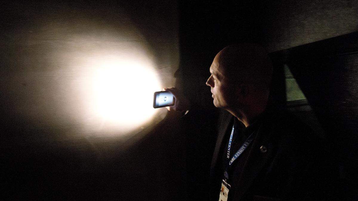 Frank Jordan searches for graffiti on the walls of former German POW prison cells at the Carl Vinson VA Medical Center in Dublin.