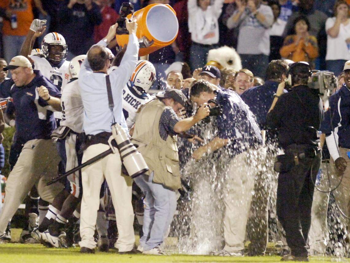 In this 2007 Telegraph file photo, Northside head coach Conrad Nix gets greeted with a tub of water after the Eagles’ 20-14 win over Ware County Friday night for the GHSA AAAA State Championship.