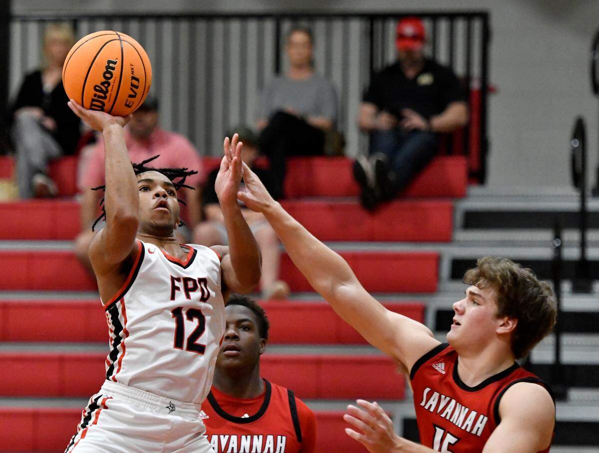 FPD’s Brycen Williams (12) puts up a shot during the Vikings’ 59-50 first round playoff win over Savannah Christian Wednesday night.