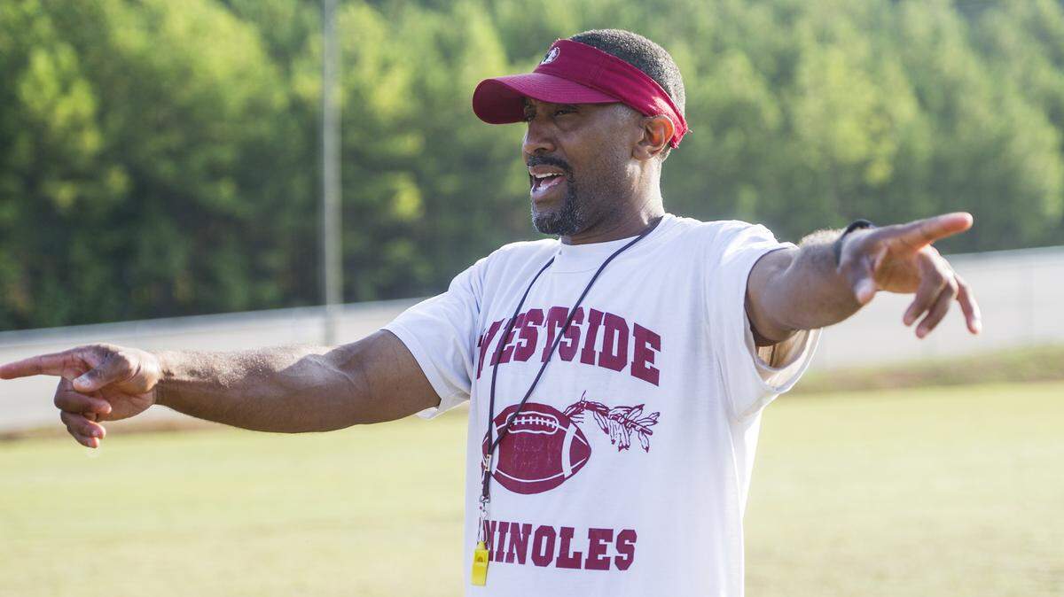 Westside head coach Spoon Risper works with receivers at a recent practice.